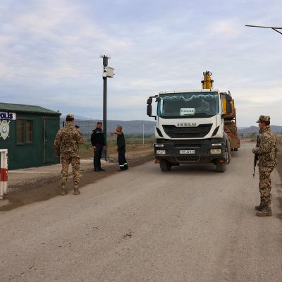 Thousands flee Karabakh; blast kills 20